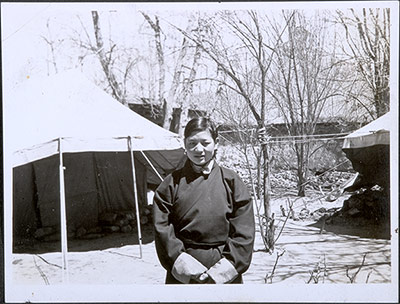 Kay Phunkhang in front of tents in Dekyi Lingka
