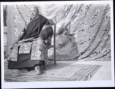 The Nechung Oracle, Lobsang Namgyal, seated on a chair