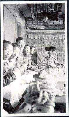 Tibetan men at a table during a New Year reception