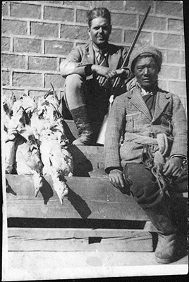 Harry Staunton and Pinzi with geese at Gyantse