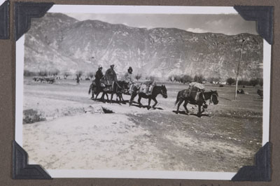 A family travelling along a road outside Lhasa
