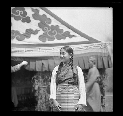 Kuku La (Pema Tsedong) in front of a tent