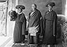 The Peak Secretary in his ecclesiastical robes with two attendants