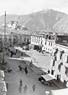 Ditto [View down onto Lhasa city (note p. poles and yaks tail)] looking w. (from same place)