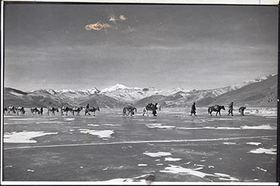 Caravan crossing Yamdrok Tso