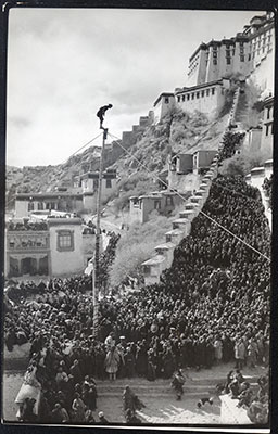 Man on pole at Namdrotagtse ceremony by Potala