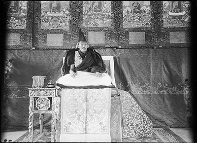 The Thirteenth Dalai Lama on throne in Norbu Lingka