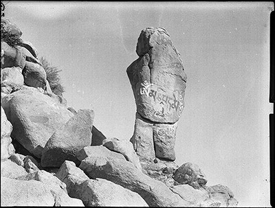 Rock with carved and painted mantra