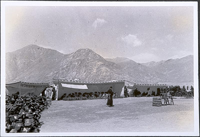 Tibetan officials seated in open-fronted tents at Trapshi