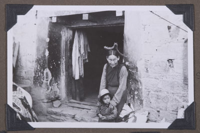 Woman and child outside shop in Lhasa