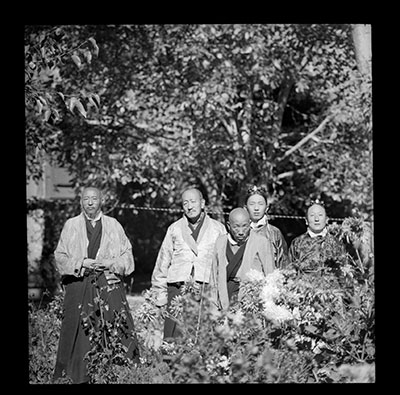 Monk and lay officials in the garden of Dekyi Lingka
