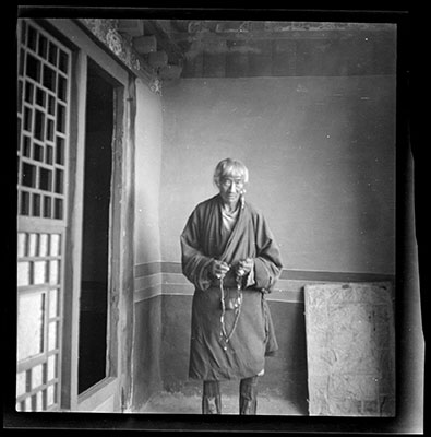 Headman with prayer beads