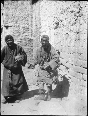 Two Tibetans, one playing fiddle