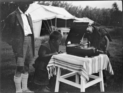 Young monks listening to gramophone
