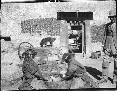 Women washing cloth in Gyantse post office yard
