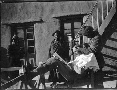 Hubbu cuts Capt Dean's hair in Gyantse dak bungalow