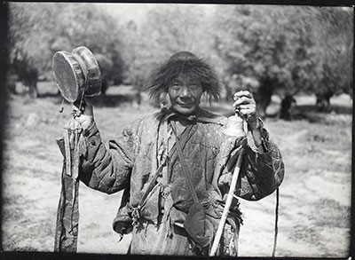 Beggar with skull-drum and dorje (sacred thunderbolt) bell