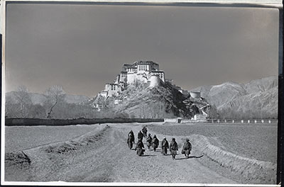 The Potala from the east. Nomads performing Holy Walk