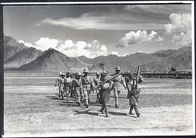 A Tibetan Lewis-gun section, showing old and new uniforms