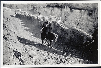 Monk riding up to Potala at New Year