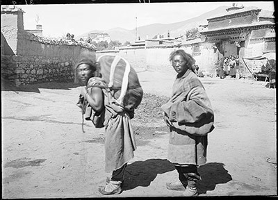 Corpse being carried away for the last rites. Ceremonial scarves are placed on the sack