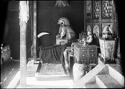 The Pavilion by the Lake. The Dalai Lama's verandah - sitting room. In it are valuable presents from Emperors of China. The Lama sits on the rug by the low table on which is the jade teacup