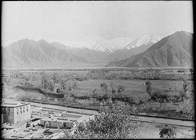 View across the Kyi Chu from the Potala. Some of the ling-kas, with which the valley is dotted, can be seen