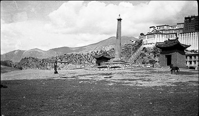 Obelisk engraved with historical inscriptions below the Potala Palace. In the small house on each side is a stone slab announcing a victory