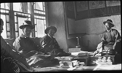 The Tibetan Council, one priest (left) and three laymen, in the Council Chamber