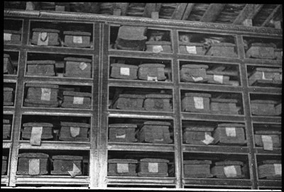 A part of a Tibetan Library. The white silk labels give the titles of the books