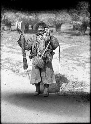 Itinerant monk with bell and skull drum