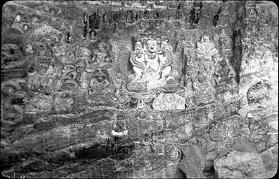 Deities carved into rock face on Lingkhor