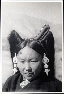 Young Tibetan woman in head dress
