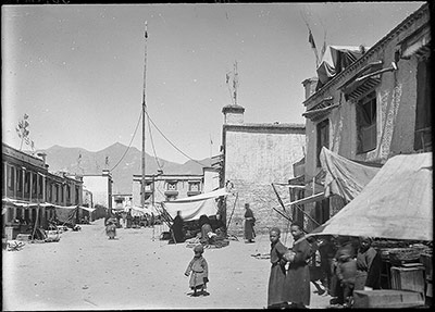 Street in Lhasa showing prayer pole