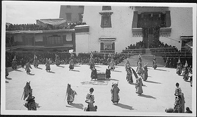Masked and black hat dancers at the Potala
