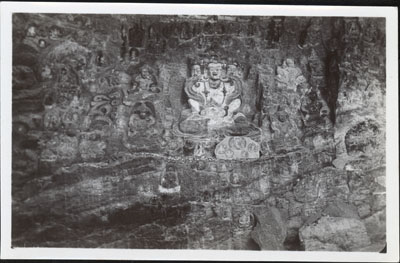 Deities carved into rock face on Lingkhor