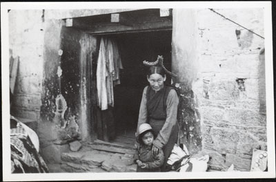 Woman and child outside shop in Lhasa