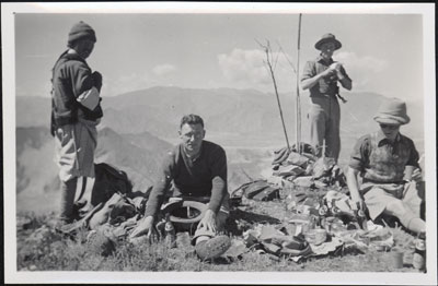 Mission staff having a picnic in the hills above Lhasa