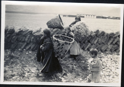 Women carrying baskets in Phari