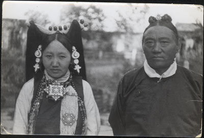 Tsarong and his wife outside their house