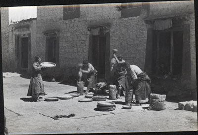 Grinding corn at house in Lhasa