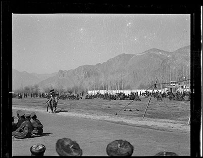 Crowd at Dzonggyap Shambe watching riding horseman