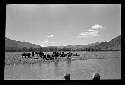 Travelers with mules waiting to cross at the Gerpa ferry