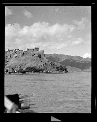 Fortress of Gongkhar Dzong with river flowing in front