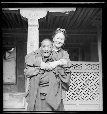Gonpo Tsering Phunkhang with arms around a monk