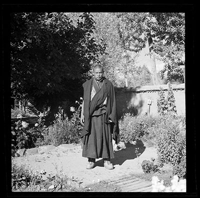 Monk in the garden of Dekyi Lingka