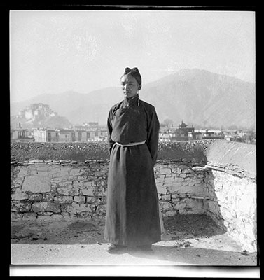 Dorje Tseten Changngopa standing on roof of his house