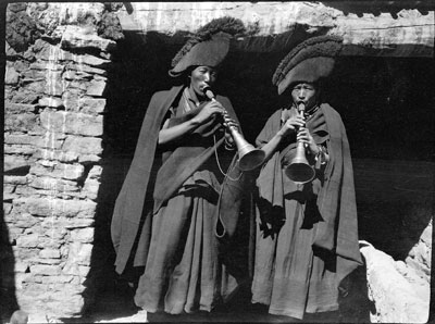 Two monks blowing short horns, Gyantse