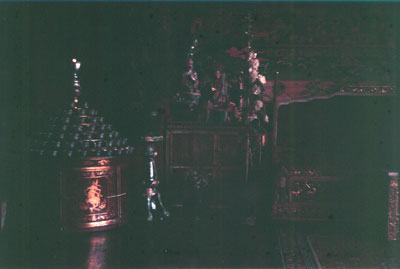 Norbu Lingka interior with large stand of butter lamps