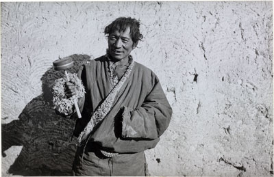 Khampa man with prayer wheel